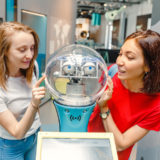 Visitors interact with a Robot assistant at the German Technical Museum