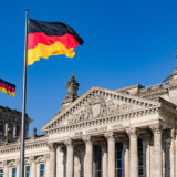 The German federal flag in front of the Reichstag