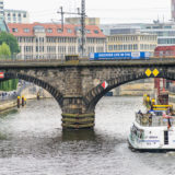 The Captain Morgan tour boat passes under the rail bridge by the Bode-Museum on the river Spree