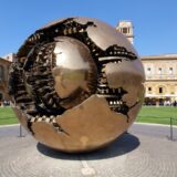 Bronze sculpture. Sphere within a sphere (Sfera con Sfera). Courtyard of the Pinecone, Vatican Museum